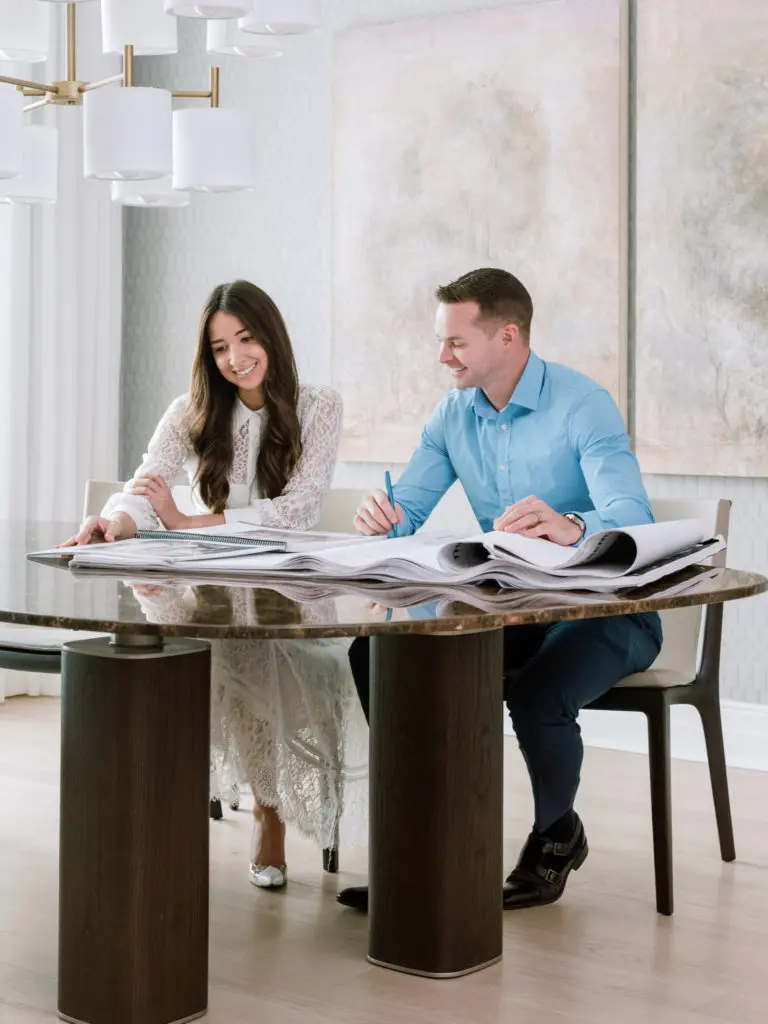 CASA Houston's Mackenzie Cash and Mirador Group principal Jerry Hooker study design options for the residence in The Sophie at Bayou Bend. (Photo by Divya Pande)