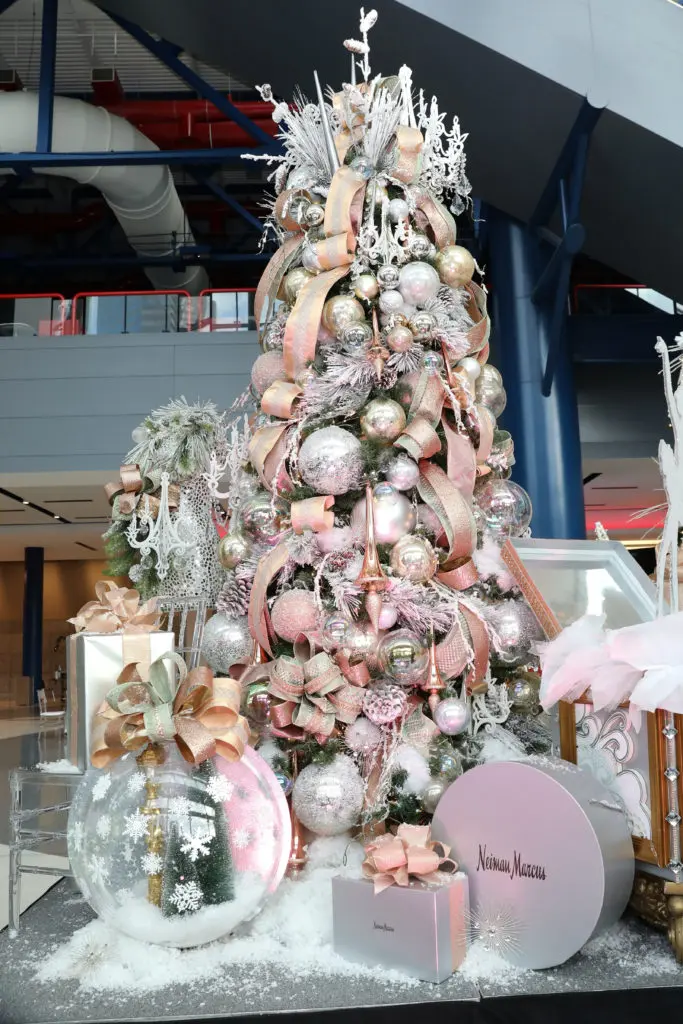The Alley Theatre Deck the Trees display of decorated conifers. The When the First Snow Falls Tree by Neiman Marcus.