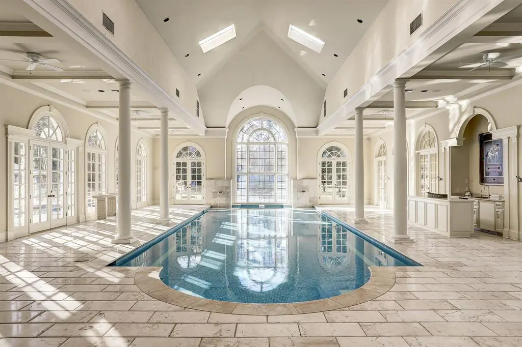 The 27 Rivercrest Drive residence boasts both indoor and outdoor swimming pools.