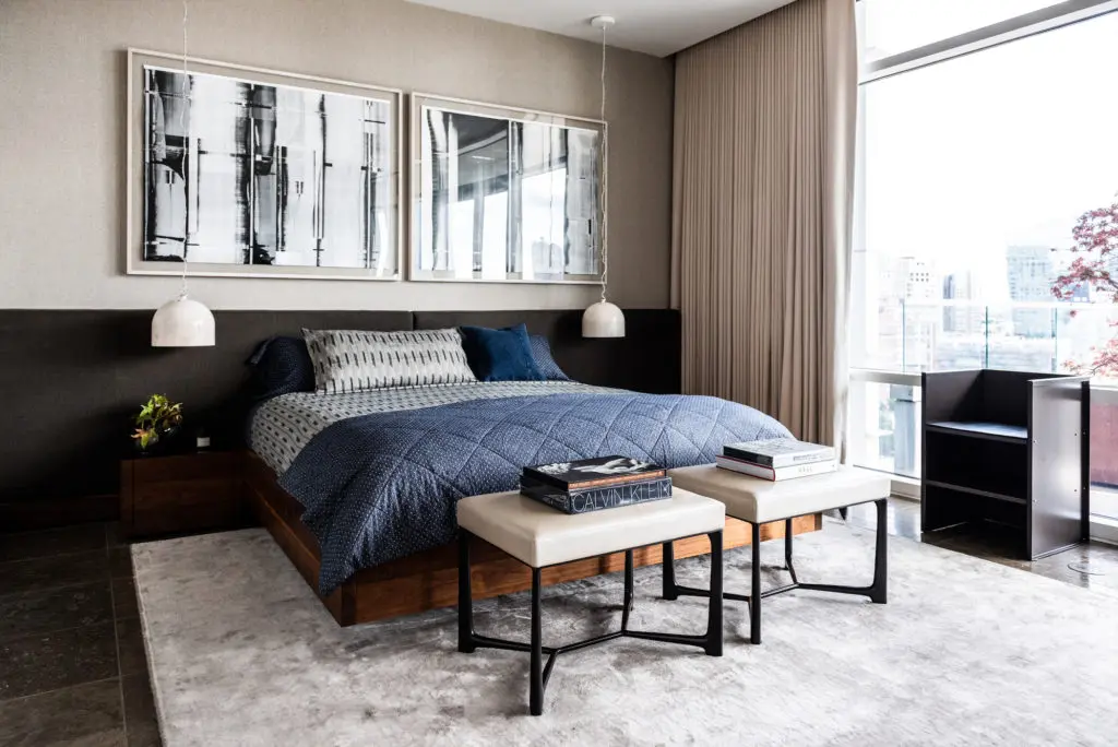 In the master bedroom, the headboard, bed, and side tables designed by Joshua Rice. Holly Hunt bronze and leather benches. Marble light pendants by Benjamin Hubert from De La Espada. Artwork, Mark Williams' "Yupo" series from Barry Whistler Gallery. Donald Judd chair from Matin Gallery, L.A. (Photo by Robert Yu)