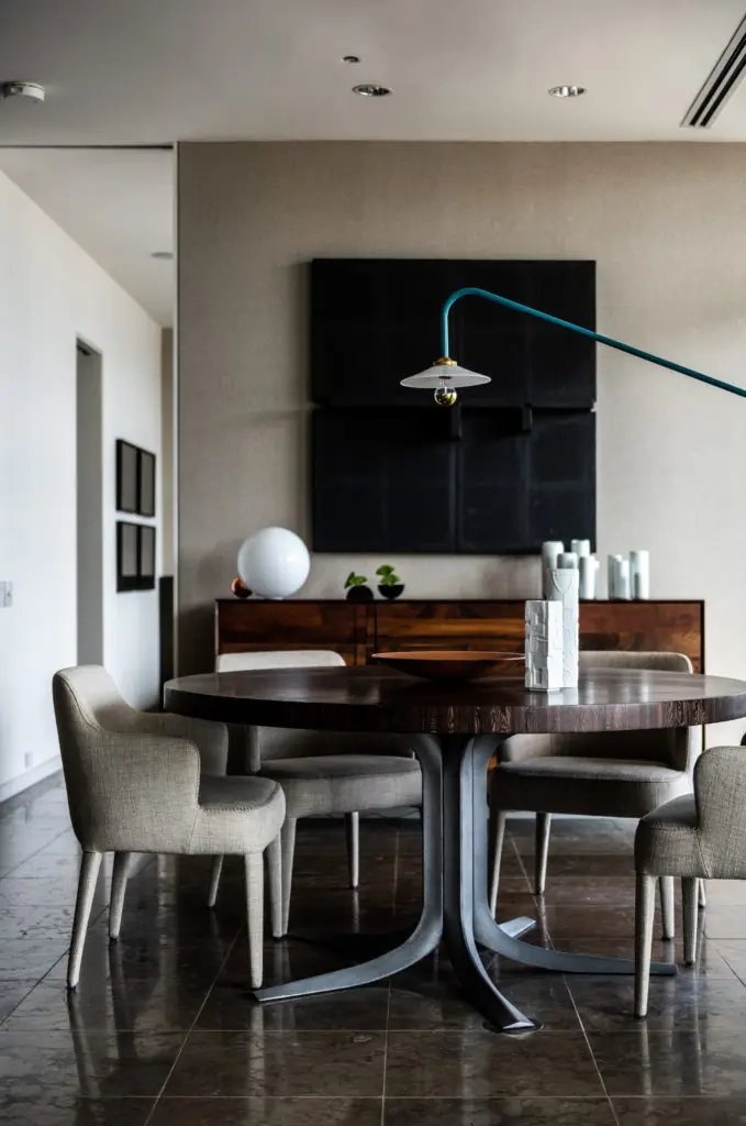 In the dining room, credenza is from BDDW, NYC. Vases by artists Lilith Rockett and Sakul Intakul. Artwork Joe Guy from William Campbell Contemporary Art. (Photo by Robert Yu)