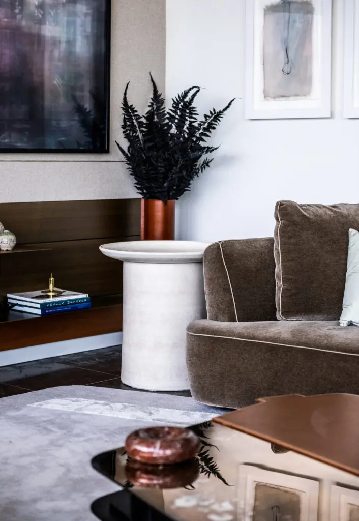 Custom rug designed by Joshua Rice and Travis LaMothe. Side table by Benjamin Wiener. (Photo by Robert Yu)