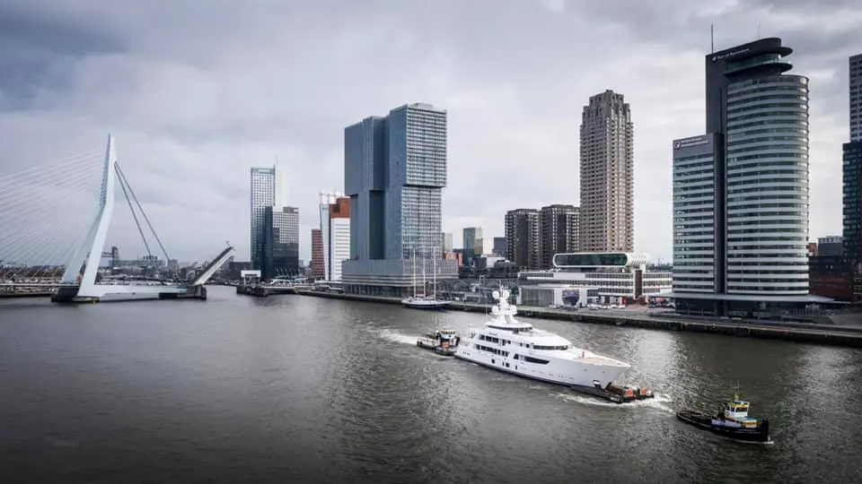 Tilman Fertitt's 77-meter Boardwalk from Feadship passes the last bridge on the to sea trials, passing the city of Rotterdam. (Photo courtesy of Feadship)⁠⠀