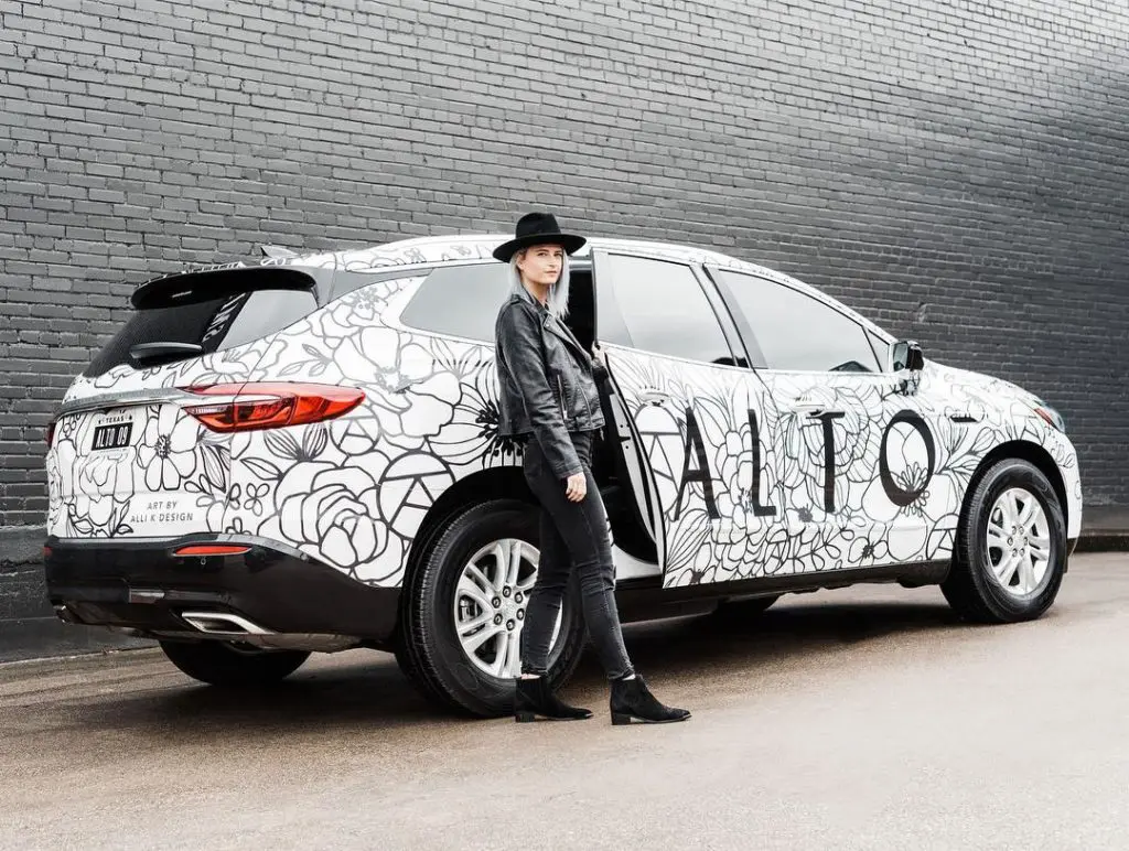 Alli K with the Art Car that she created for Alto in Dallas — the art car is a tradition of transforming the Buick Enclaves. (Courtesy of Alli K Design)
