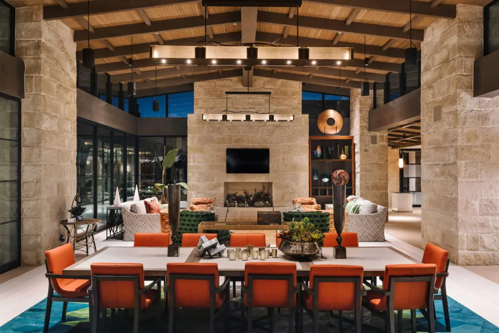 This modern ranch in the Texas Hill Country by J Christopher Architecture, rests atop a rocky cliff overlooking rushing creek waters below. (Photo by Chase Daniel)