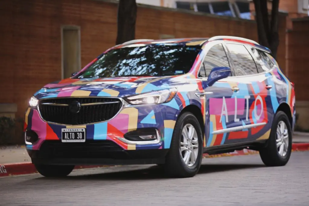 Dallas artist Mariel Pohlman creates a colorful art car for Alto, the Dallas-based ride-hailing/delivery service business.