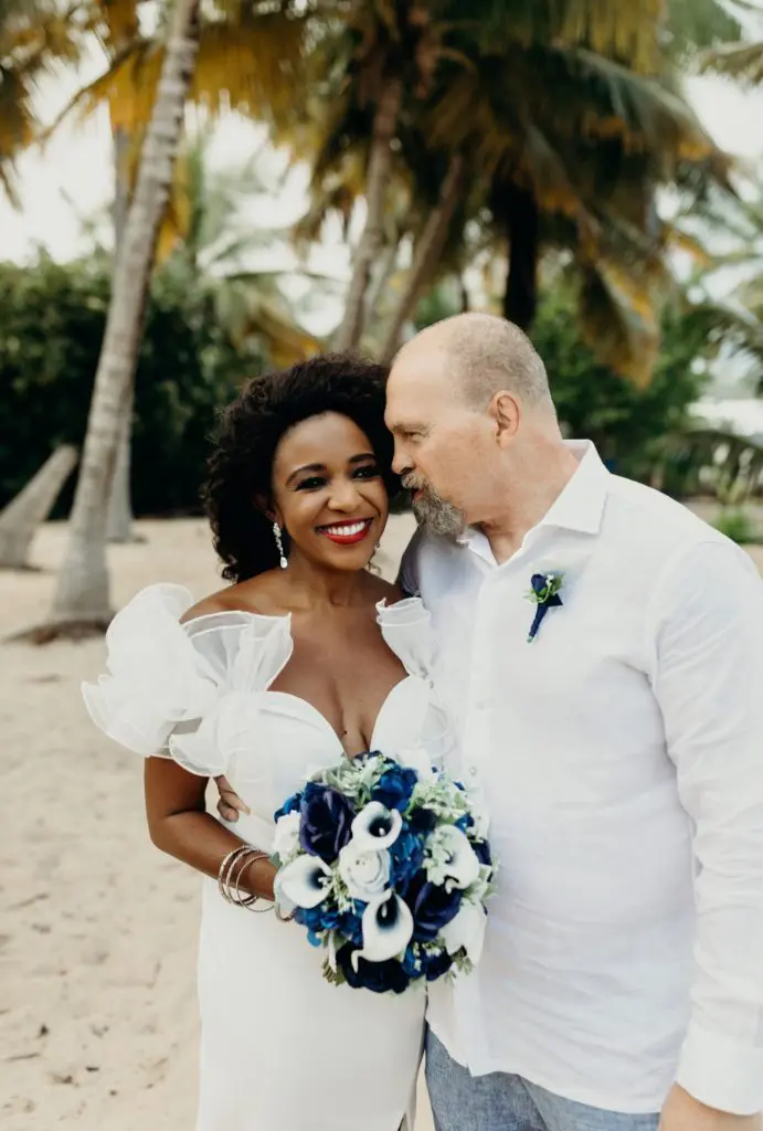 Jacquie Baley & James Craig share a moment following their ceremony on the beach at St. Croix in the U.S.Virgin Islands. (Photo by Meredith Zimmerman)