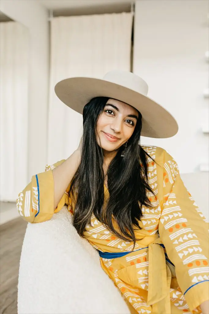 Sofiya Deva, founder of This Same Sky, a sustainable luxury brand, wearing her Dream Robe in "Sunbeam" ($168)