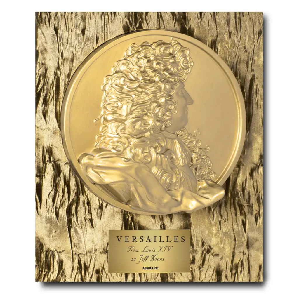 A gold sculpted medallion of Louis IV decorates the case of Versailles: From Louis XIV to Jeff Koons Special Edition (Photo by Assouline)