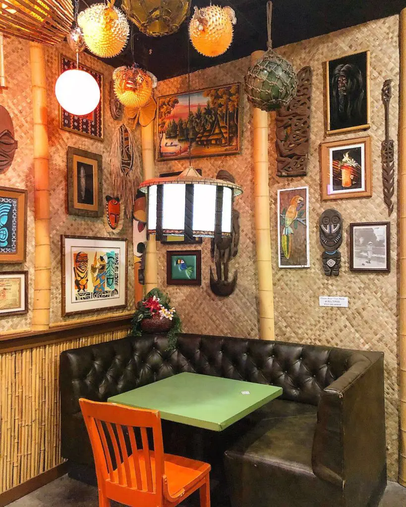 Swizzle's interior is decked out in tiki decor and color-changing lights. (Courtesy of Swizzle)
