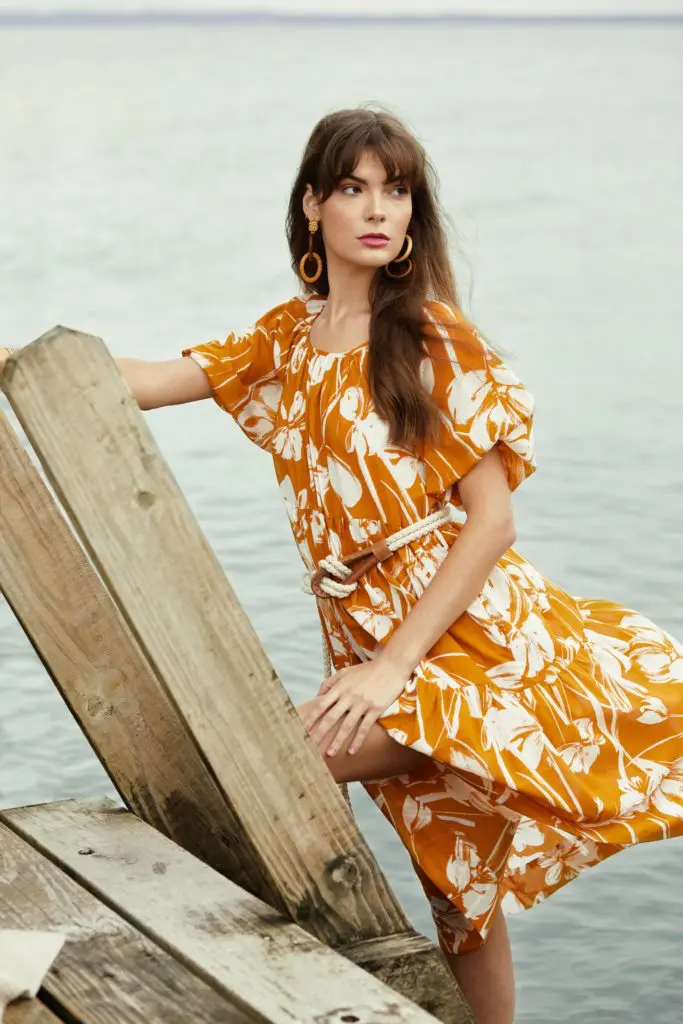 Christy Lynn's Audrey midi-dress in the Soleil fabric features a short puffed sleeve with a three-tier skirt.
