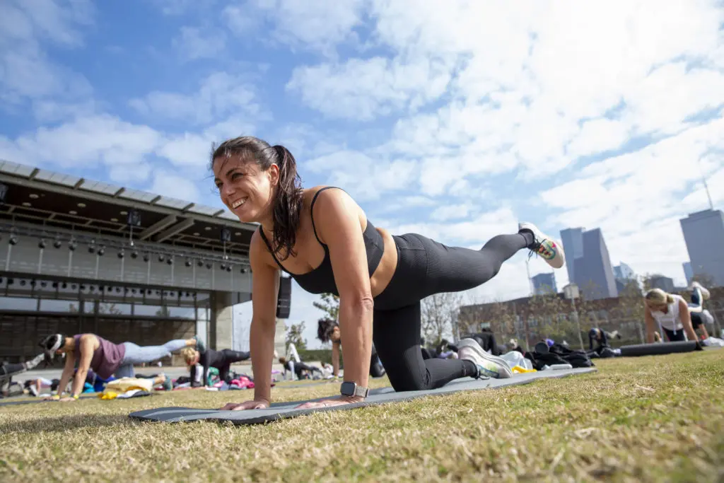 Nicole Hoffman, Houston city leader for Carbon38, works her glutes during the Savor + Sweat workout at Buffalo Bayou Park.  (Photo by Jenny Antill Clifton)
