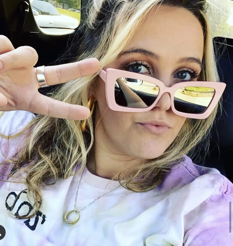Billboard chart topping new country artist Priscilla Block dons transparent sunglasses for an Instagram moment.