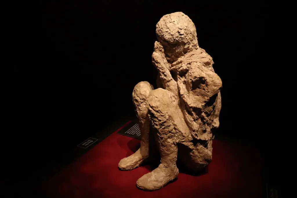 The "Crouched Man" body cast captures the moment life ended for Pompeii. 
