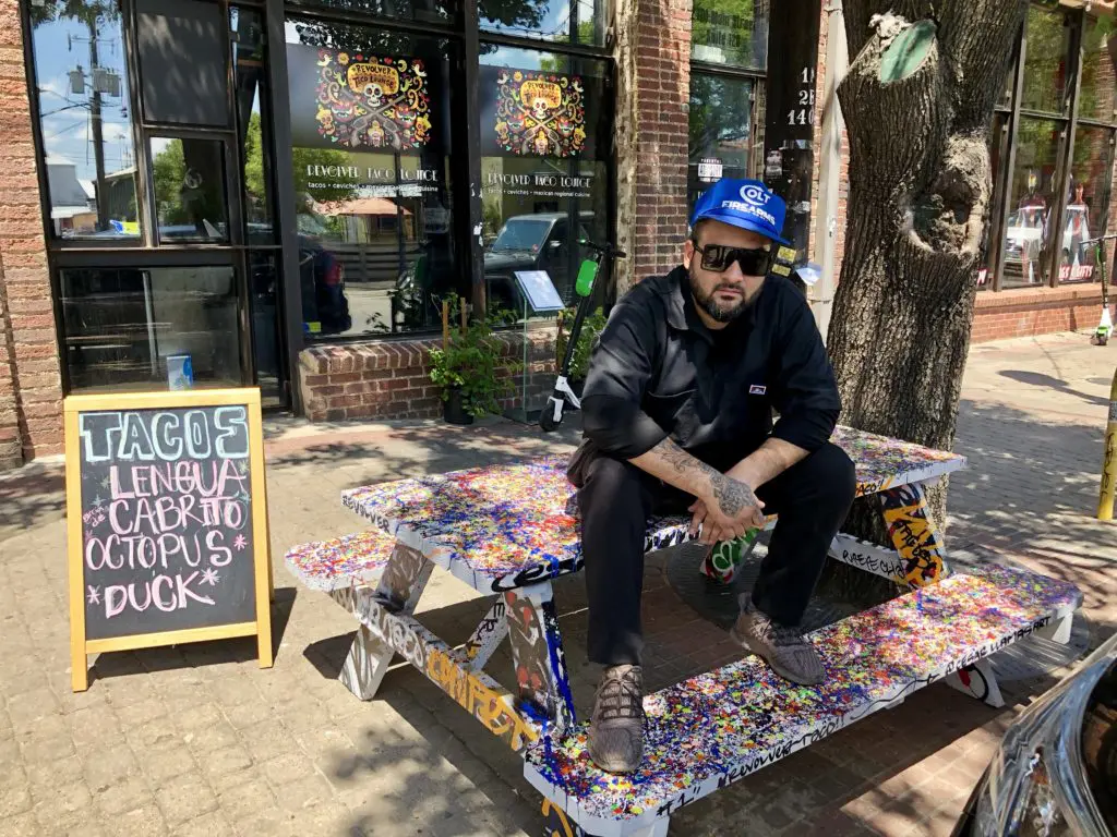 Regino Rojas in front of his Deep Ellum Revolver Taco Lounge.