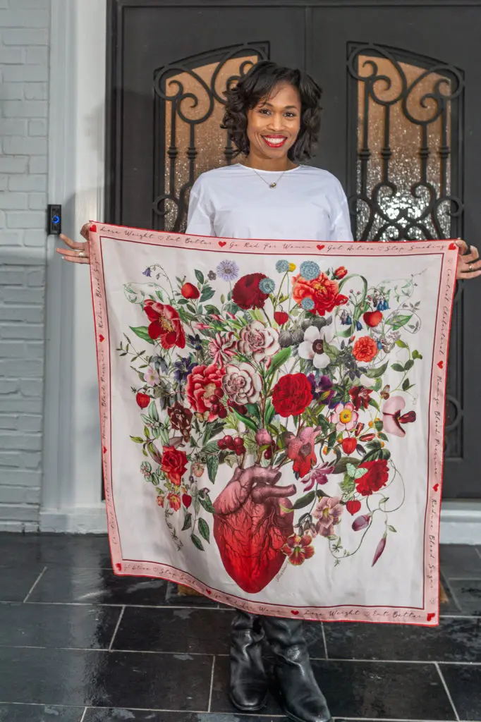 Roslyn Bazzelle Mitchell displays her commemorative American Heart Association scarf by RoKi. (Photo by PWL Studio)