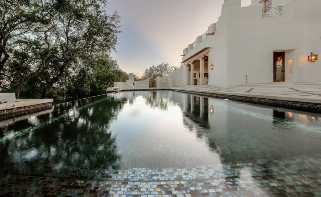 The swimming pool with iridescent tiles is a recent addition to the George Strait home in San Antonio. (Photo by LRES)