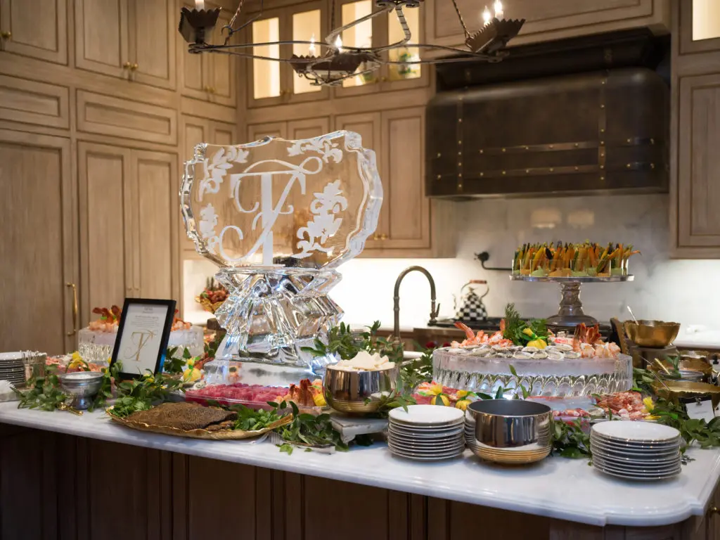 The buffet table loaded with seafood offerings from Tony's catering enticed Frances Moody and Tony Buzbee's guests.