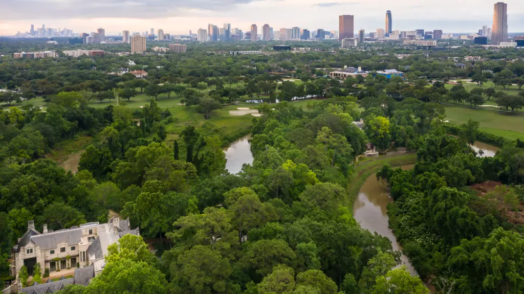 The Romanov Estate is wrapped by the lush golf course of Houston Country Club. 