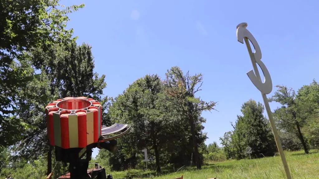 A Greater Houston Sports Club target launcher waits for shooters to shout, "Pull!" and send shooting clays into the air.