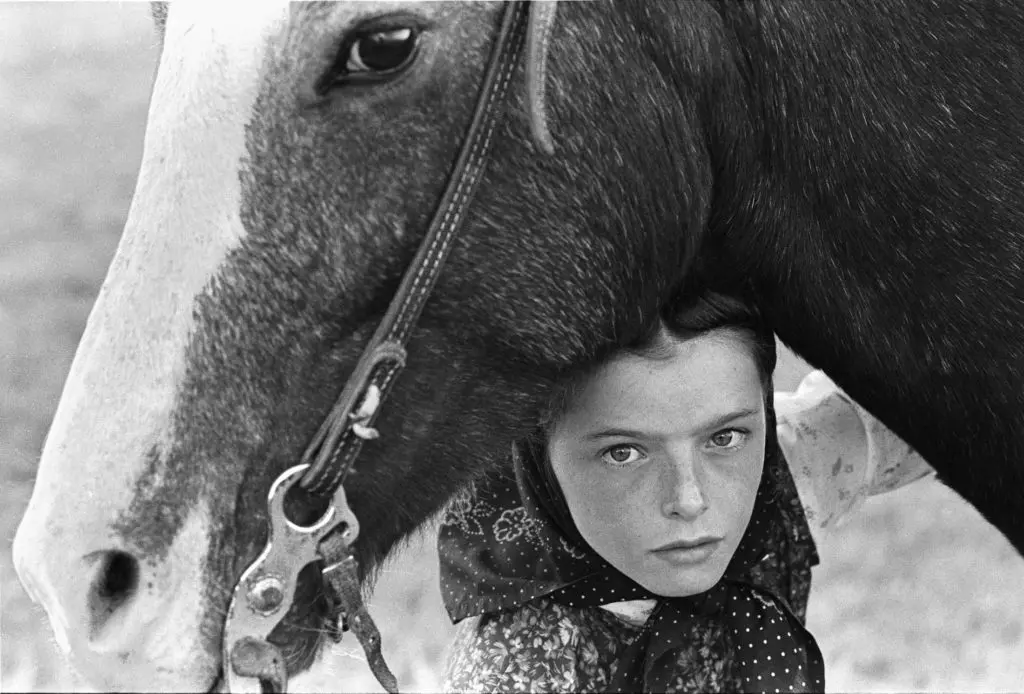 Laura Wilson's "Hutterite Girl with Her Horse, Chattahoochee, Surprise Creek Colony, Stanford, Montana," 1992 at Red & White Gallery.