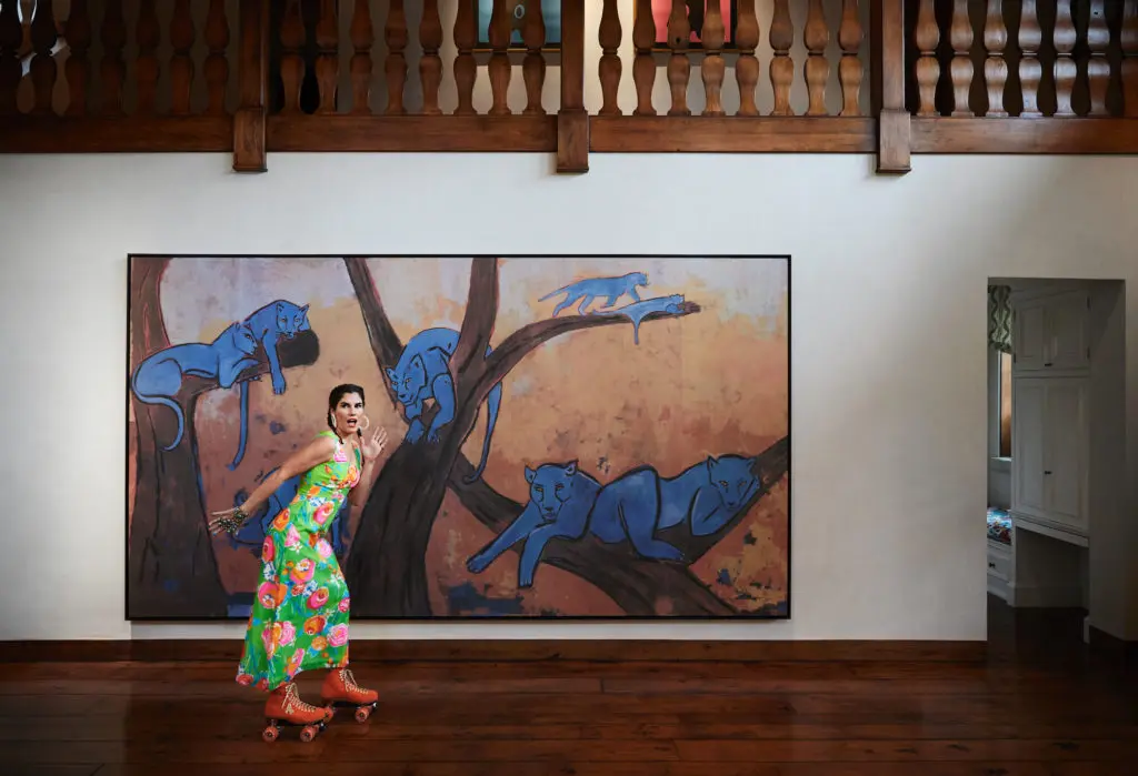 April Manson skates by a framed Zuber hand-painted wallpaper panel. (Photo by Pär Bengtsson)