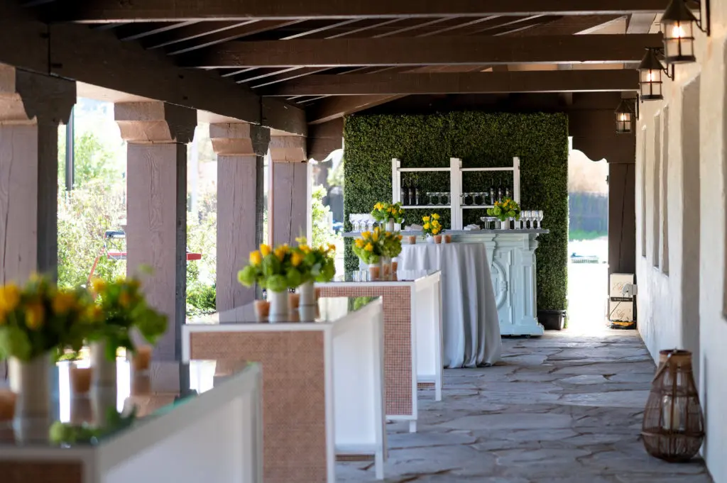 The back loggia at Hermann Park Conservancy's Lott hall is set with bar and cocktail tables. (Photo by Sarah Austin of Chris Bailey Photography)