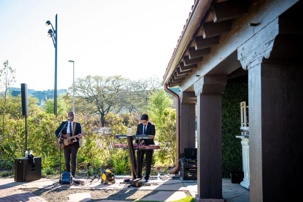 American Idol alum Adrian Michael performs for the wedding staging at Hermann Park Conservancy's Lott Hall.  (Photo by Sarah Austin of Chris Bailey Photography)
