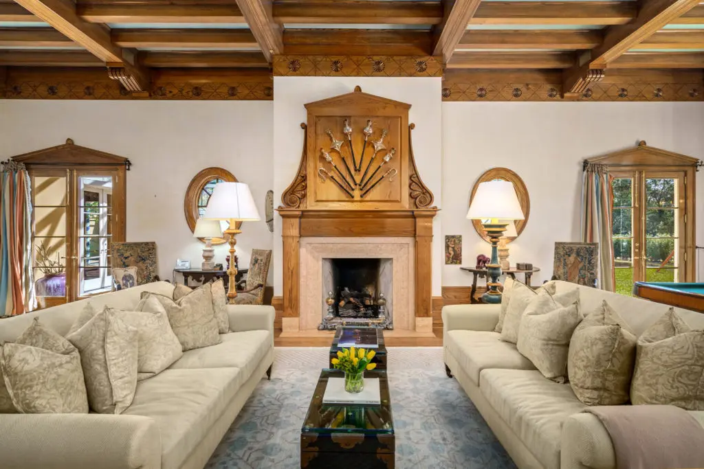 The beamed ceiling of the family room in the Gerald Hines River Oaks home lends a casual ambience to the otherwise formal dwelling. (Photo by Sonya Bertolino)