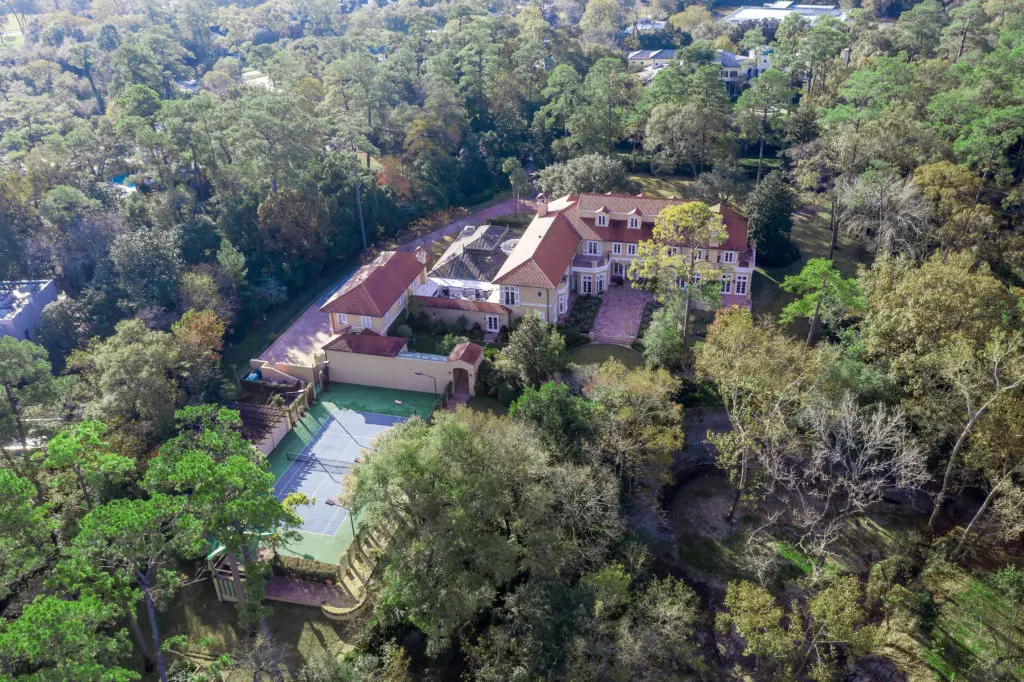 The arial view of the Gerald Hines home in River Oaks reveals a tree-shaded estate spread across 4.5 acres. (Photo by Sonya Bertolino)