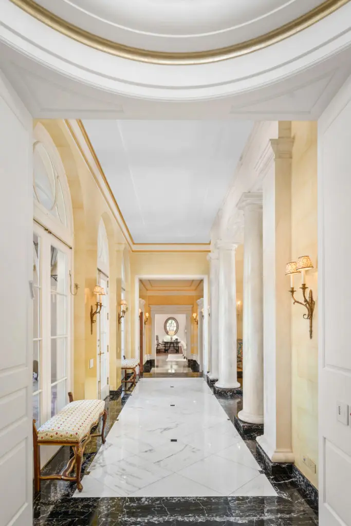 The marbled hallway of the Gerald Hines home opens to the living room on the right and the terrace on the left. (Photo by Sonya Bertolino)