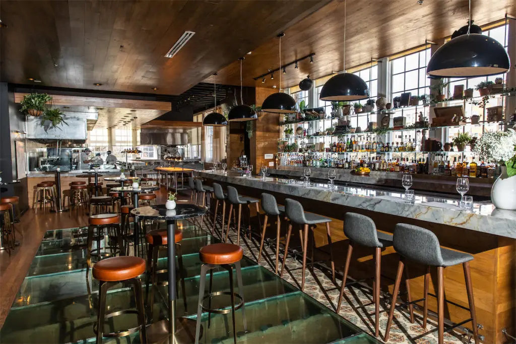 The Saint Ann bar was renovated with new hightop tables and open-kitchen concept. (Photo by Reed J Kenney)