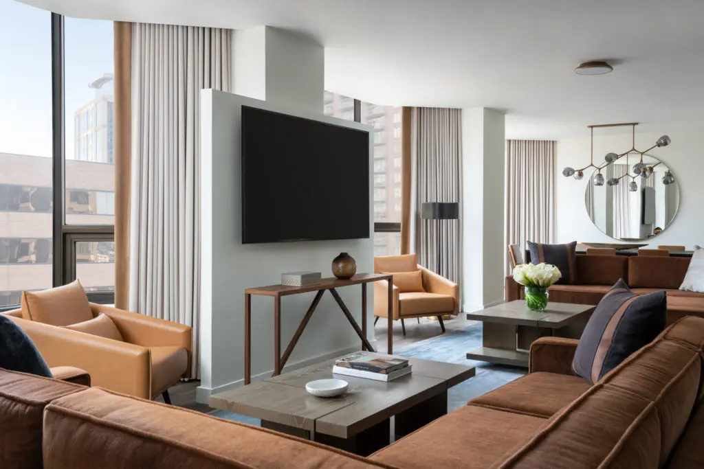 Decor in the Four Seasons Hotel Houston Presidential Suite reflects a Texas esthetic in a camel and blue palette, the work of Rottet Studio. (Photo by Four Seasons Hotel Houston)