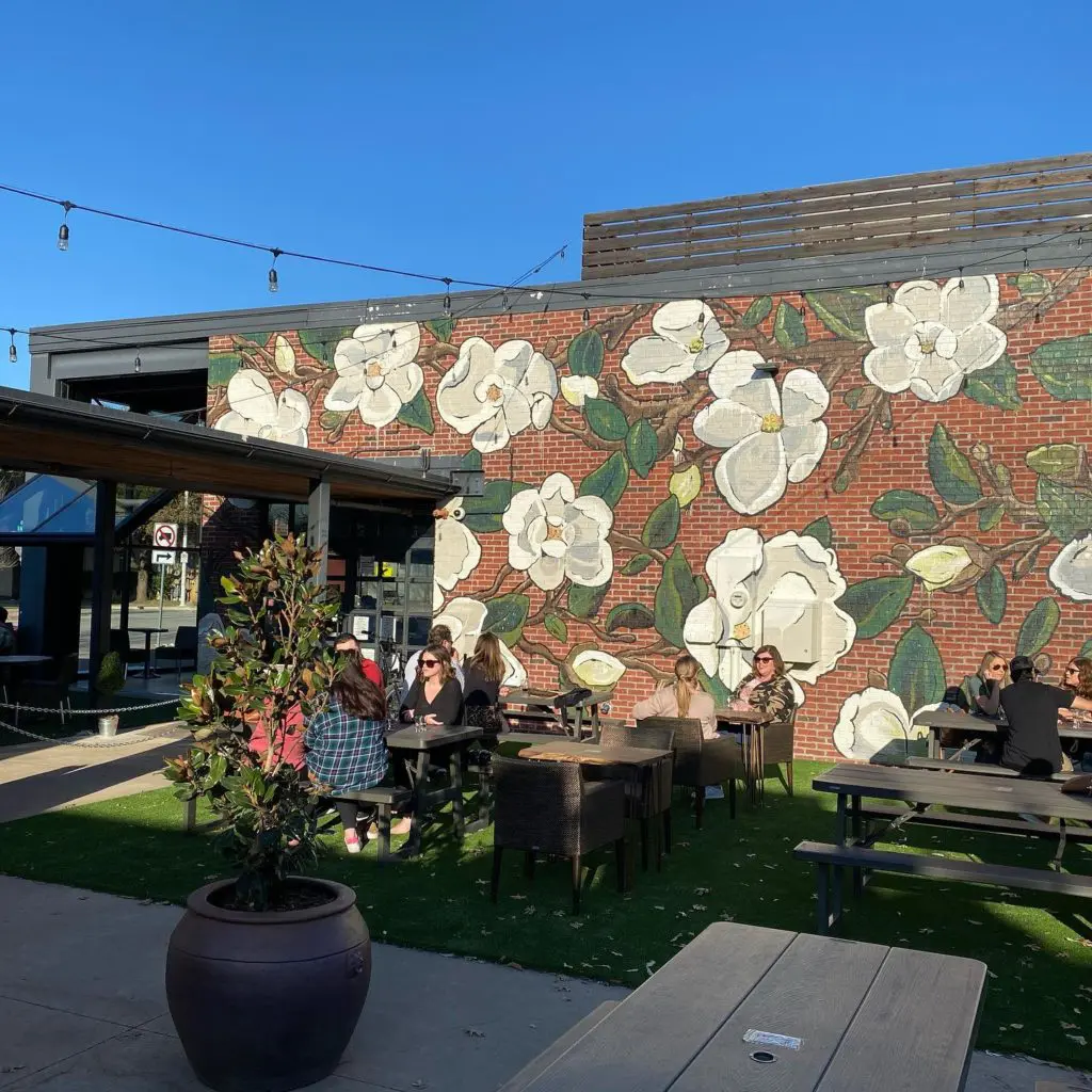 Muralist Kristen Soble had a big hand in the rebrand of Magnolia Wine Bar. 