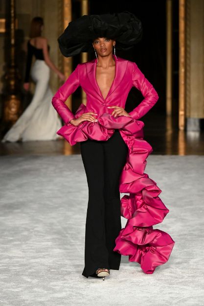 Christian Siriano red blouse with ruffled train, black slacks. (Photo courtesy of Christian Siriano)