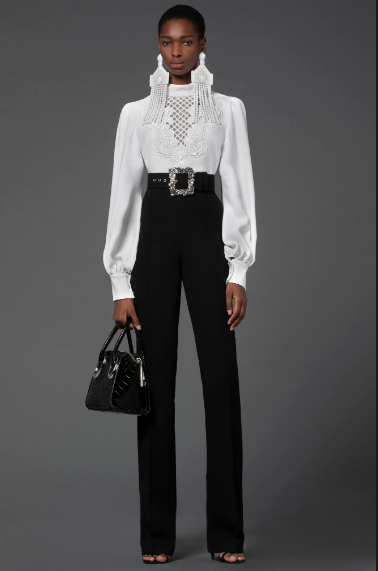 Andrew Gn white lace blouse, place trousers, shoulder duster earrings. (Photo courtesy of Andrew Gn)