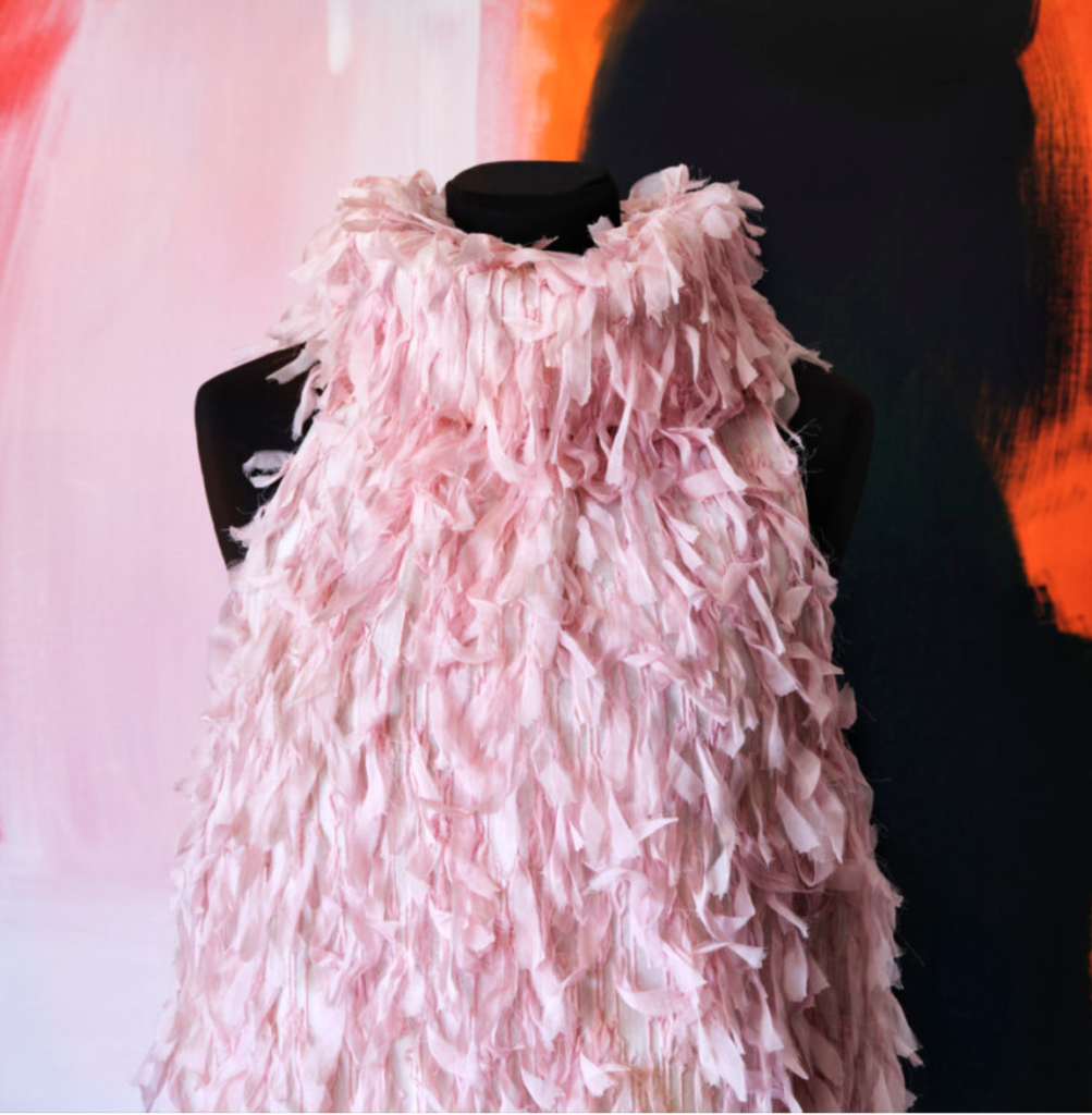 Photographed in the Haus Alkire Round Top studio, the pink tulle couture dress is covered with little silk ribbons. (Photo by Lisa Petrole)