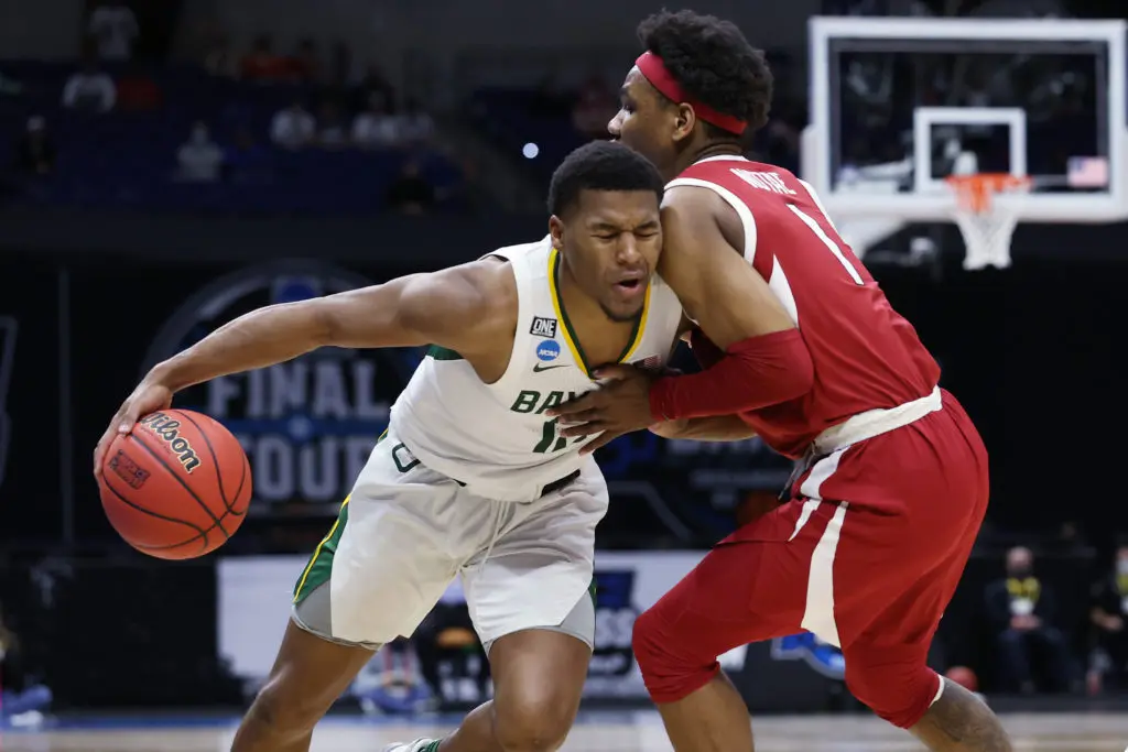 Jared Butler (No. 12) of the Baylor Bears  calls a potential Gonzaga-Baylor showdown a Batman vs. Superman scenario. And Houston? (Photo by Trevor Brown Jr./NCAA Photos via Getty Images)