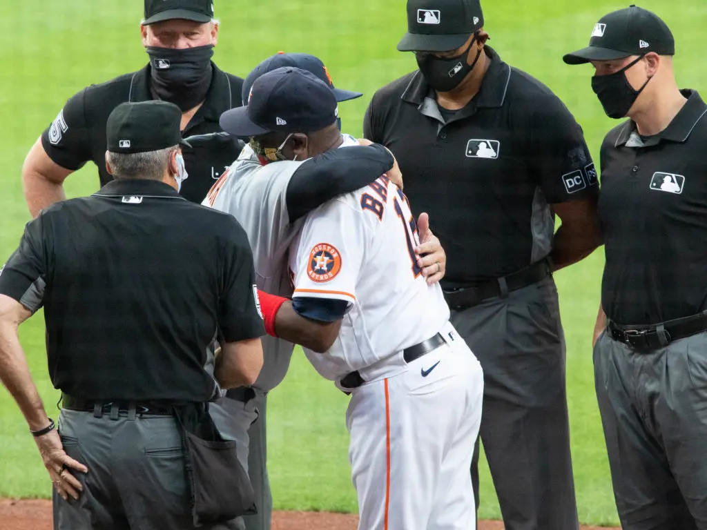 A.J. Hinch and Dusty Baker and exchanged hugs along with lineup cards. (Photo by F. Carter Smith)