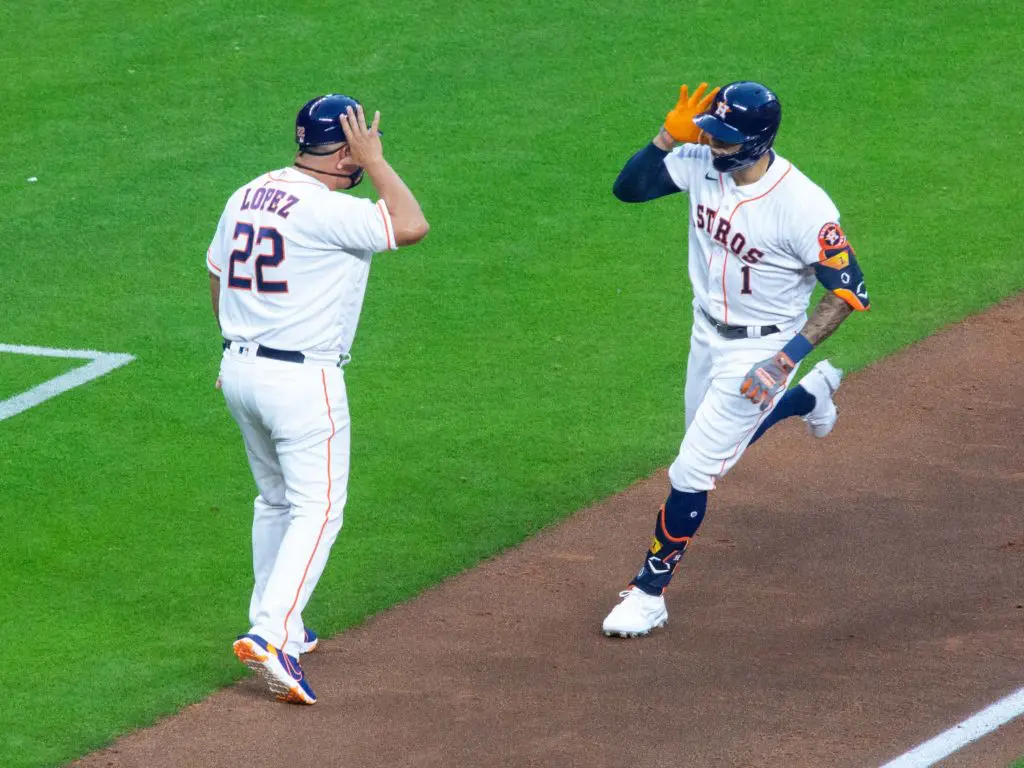 Carlos Correa even gets Astros coach Omar Lopez into his home run fun. (Photo by F. Carter Smith)