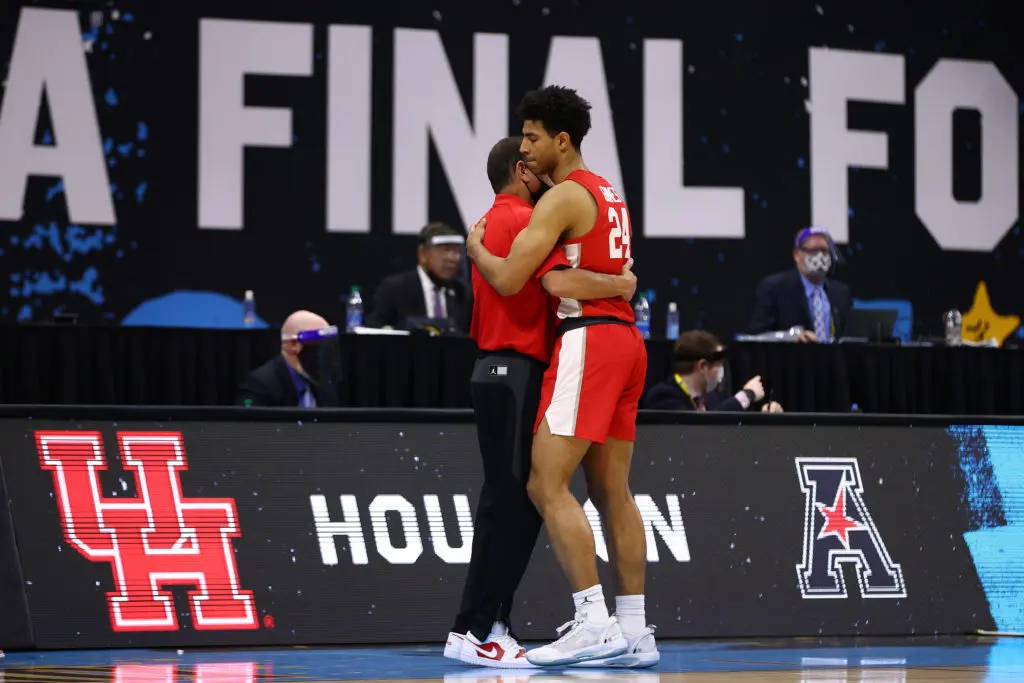 Kelvin Sampson embraces Quentin Grimes after Houston's loss to Baylor in the Final Four. (Photo by Jamie Schwaberow/NCAA Photos via Getty Images)