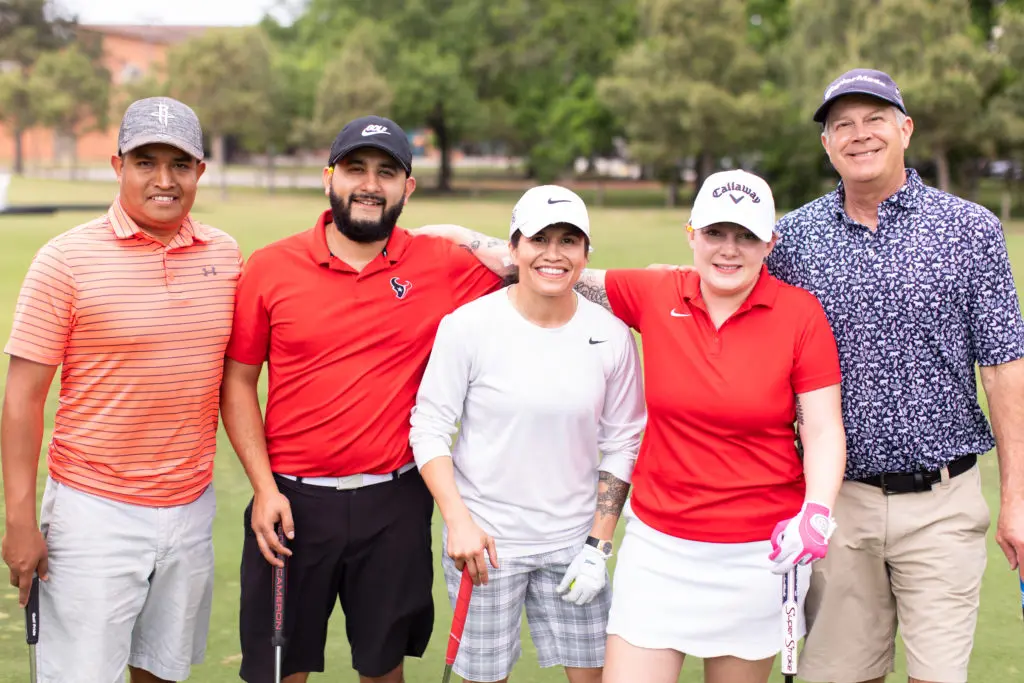 Jose Canales, Enrique Montes, women's MMA fighter Jessica Aguilar, Shannan Canales, Tom Whitehead at the Lucille's 1913 golf tournament awards dinner at Hermann Park Golf Course. (Photo by Leah Wilson)