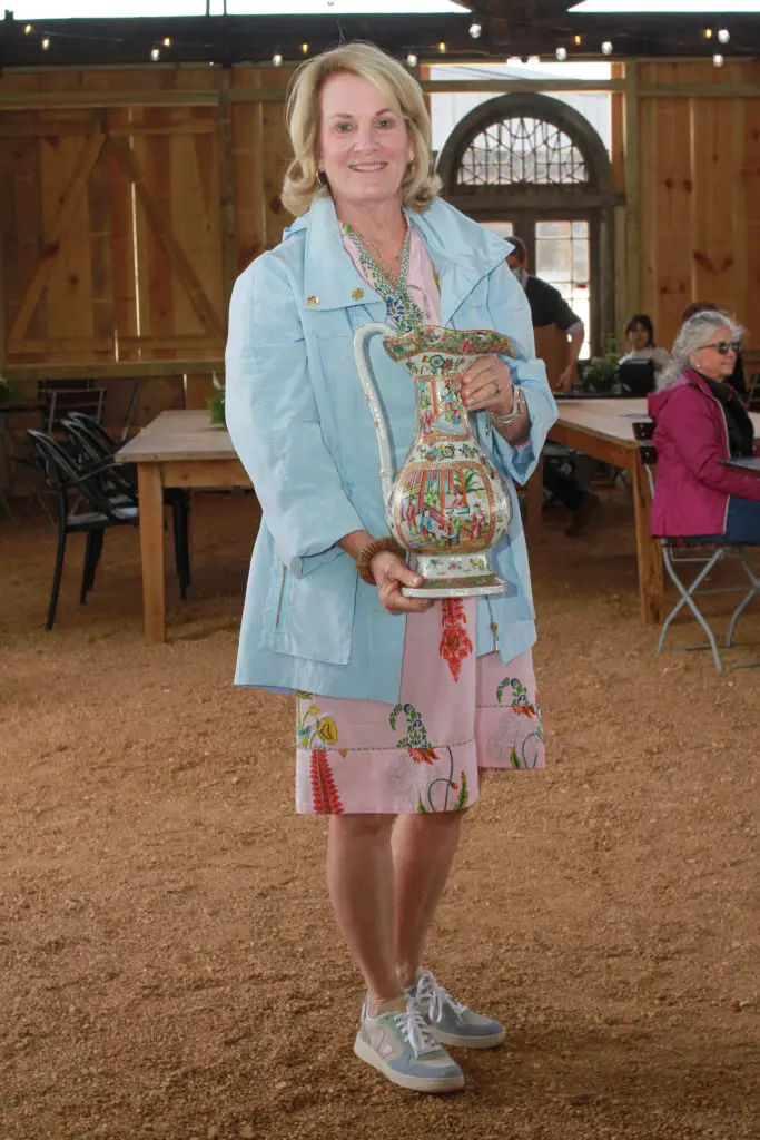 Melinda Abell holds a family treasure: a Rose Famille Chinese porcelain. (Photo by Chris P. Bachman)