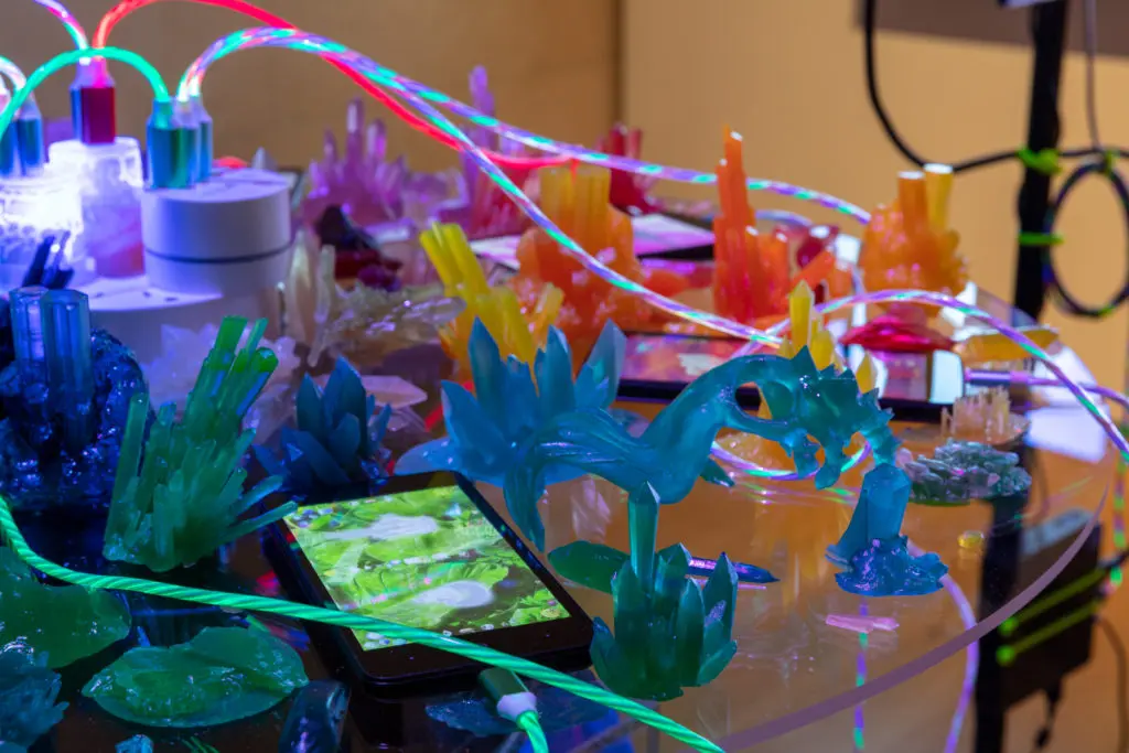 "Recharge" is a rotating disc populated with smartphones and healing crystals.