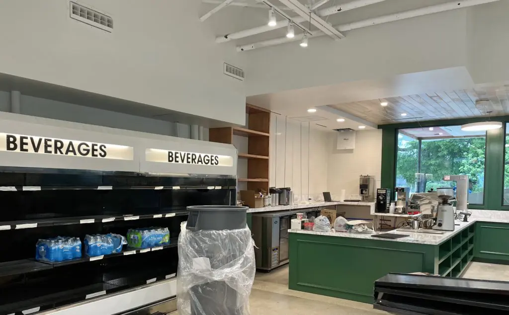 The grab-and-go beverage case and the new coffee and wine bar take shape. (Photo by Courtney Dabney).