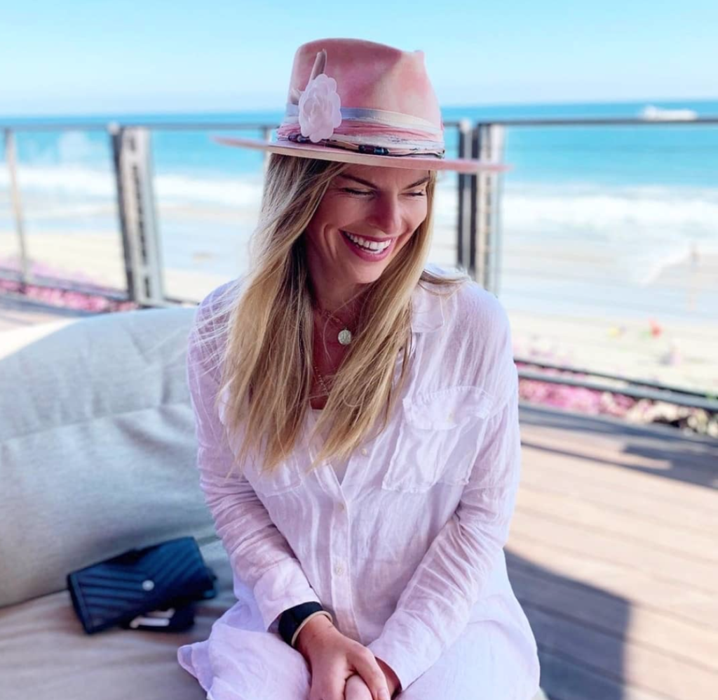 Social strategist for music based brands Karin Kildow models one of Teressa Foglia's stylish hats. (Instagram photo)