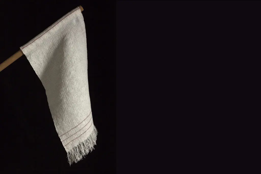 Sonya Clark an American fiber artist of Afro-Carribean heritage uses different material and objects to shed light on personal and cultural stories. In collaboration with the Fabric Workshop and Museum, Philadelphia, Sonya Clark's woven replica of the Confederate Flag of Truce, 2019. (Photo by Carlos Avendaño) 