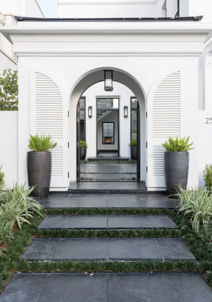 Entry to the home in Glendower Court is via an arched gateway with a direct line of sight and striking views through the door, past the courtyard and entry foyer into a secluded pool courtyard.   (Photo by Sonya Bertolino)