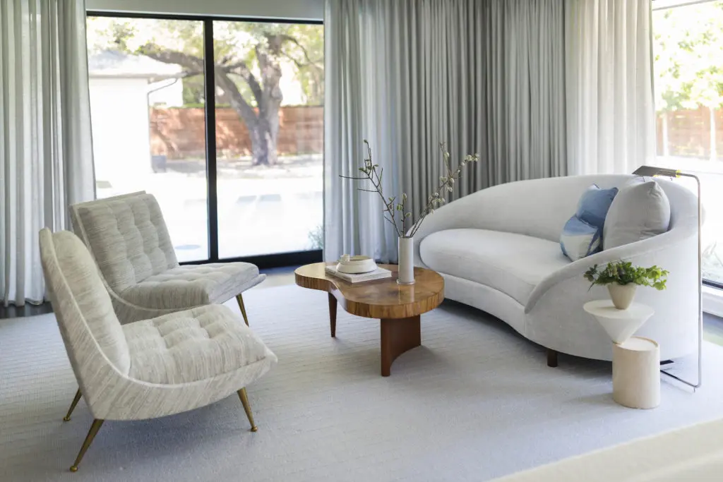 In the main bedroom sitting area, chaise designed by Wendy Konradi, in Rogers & Goffigon velvet. Limestone-and-lacquer side table by Luca Nichetto, from The Future Perfect. Italian slipper chairs, ’60s era. (Photo by Addison Jones)