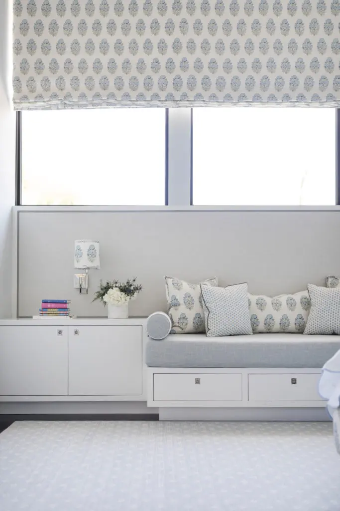 In the daughter’s bedroom, shades and pillows in Lisa Fine textiles. Built-in daybed and tables designed by Wendy Konradi. Magnetized linen wallpaper becomes a bulletin board for mementos. (Photo by Addison Jones)
